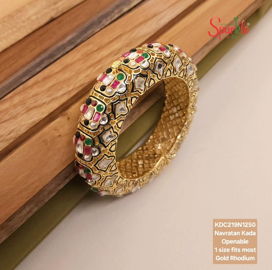 Decorative gold bracelet with gemstones, branded 'Sparkle'.