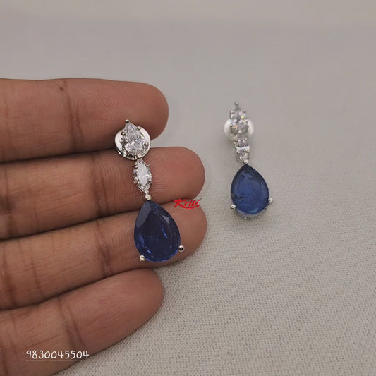 Earrings embellished with original Austrian crystals from swarovski setted with pear shaped Semiprecious Blue Doublets