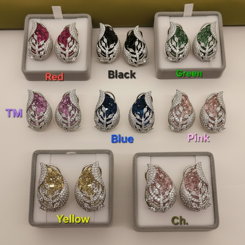 Set of earrings in various colors with color labels on a white surface.