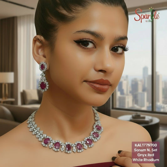 Woman wearing a necklace and earrings with 'SparkleBYDJ' branding