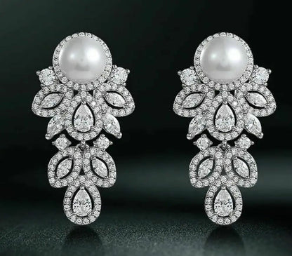 Ornate Cubic zirconia earrings embellished with round shaped Pearl