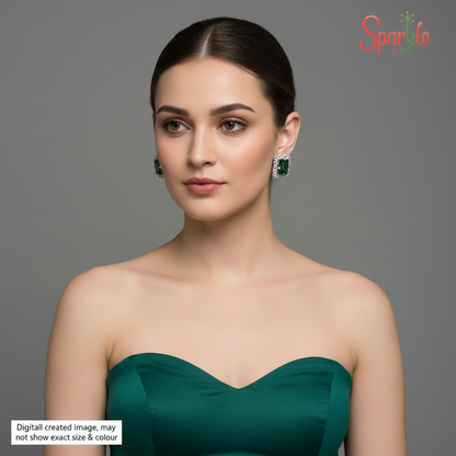 Pair of green swarovski earrings with silver accents on a beige background, branded 'SparklebyDJ'.