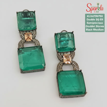 Green gemstone earrings on a light background with 'Sparkle' branding.