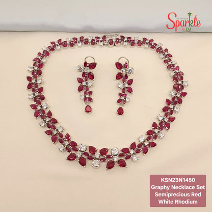 Graphy necklace set with semiprecious red and white stones on a beige surface, branded 'SparklebyDJ'.