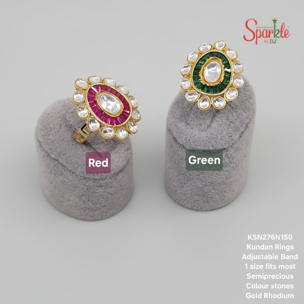 Two Kundan rings, one red and one green, on gray stands with 'SparklebyDJ' branding.