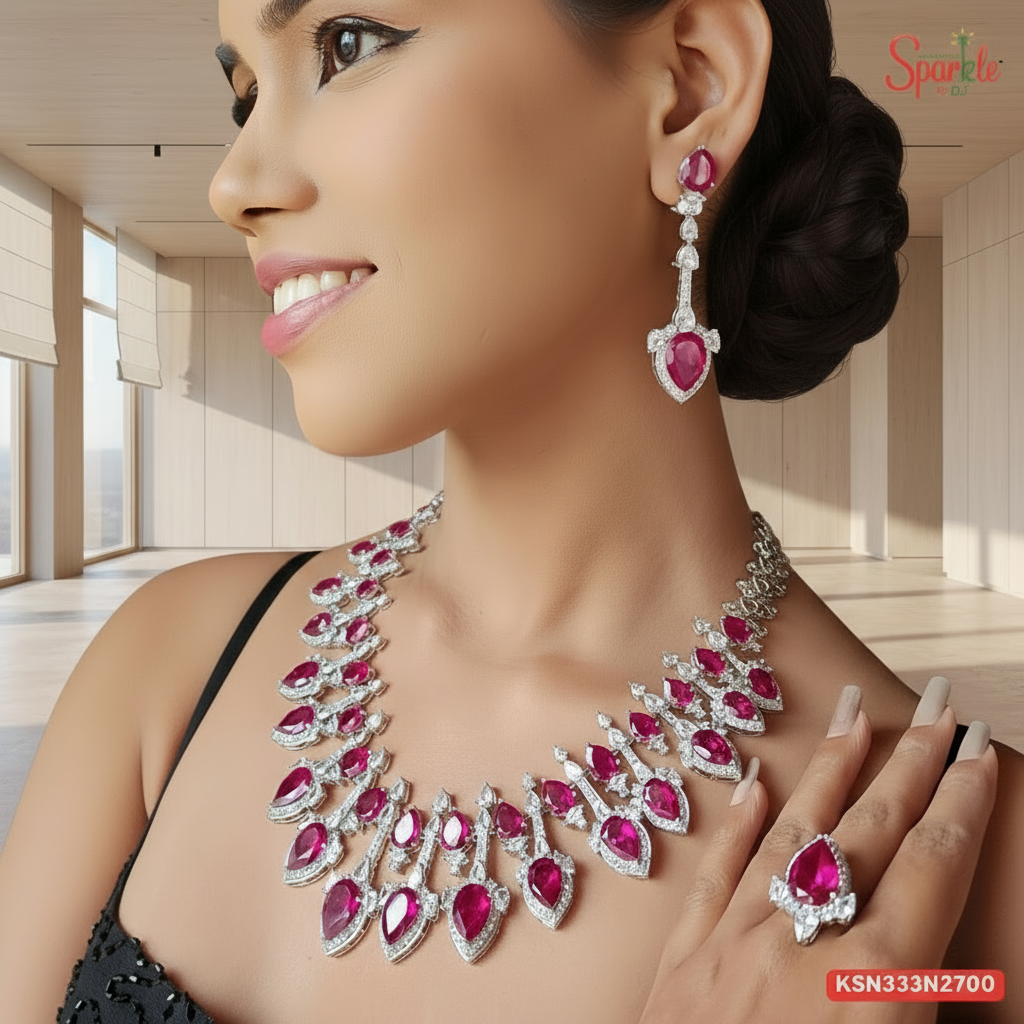 Woman wearing a red gemstone necklace, earrings, and ring with 'Sparkle' branding.