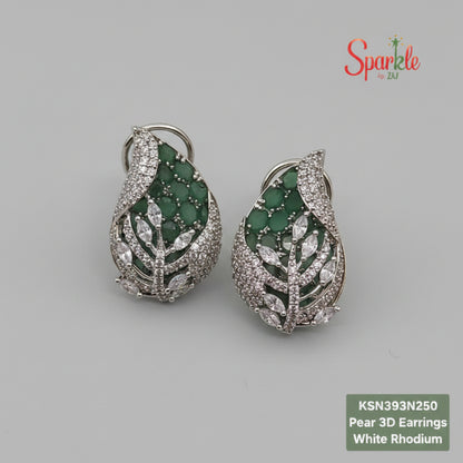 Pear 3D green earrings with green gemstones and white rhodium on a beige surface, branded 'SparklebyDJ'.