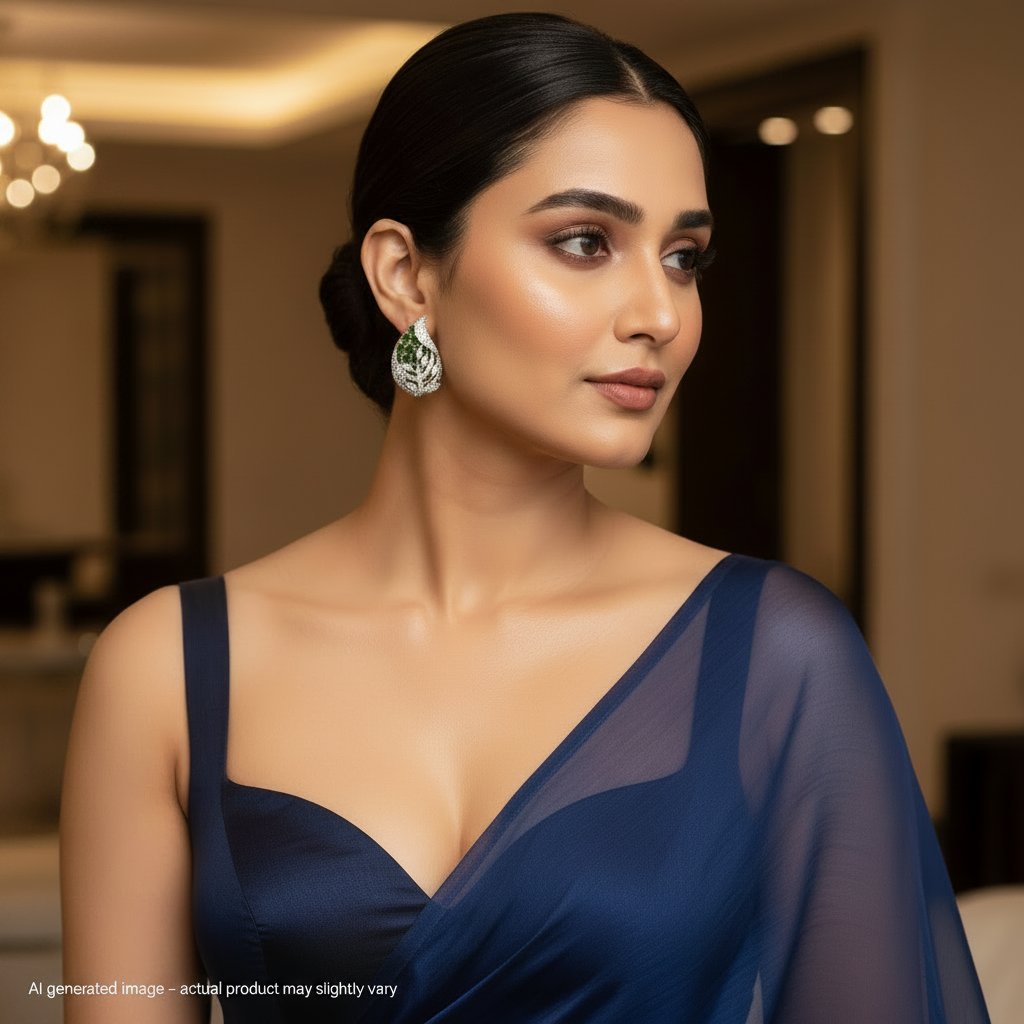 Woman wearing a blue dress with a blurred indoor background with Pear Green earrings