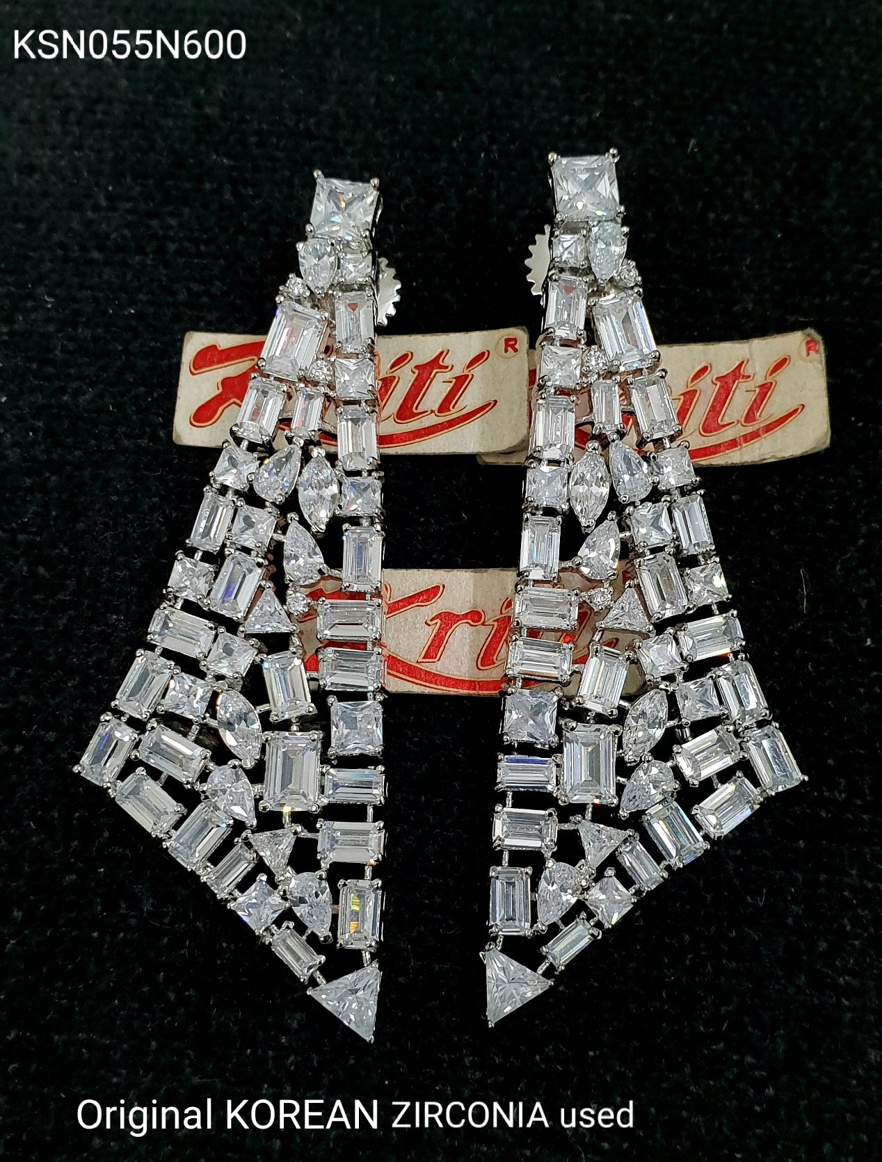 Designer triangular shaped fun earrings embellished with octagonal shaped Korean zirconias