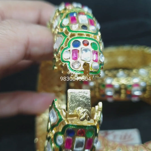 Openable Navratan Kada (bracelet) embellished with semiprecious stones and Fine Kundan.